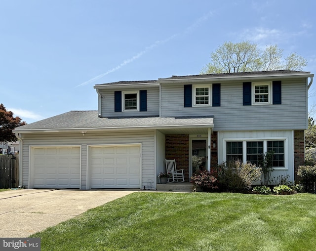 traditional-style house with a porch, a garage, a front lawn, and concrete driveway
