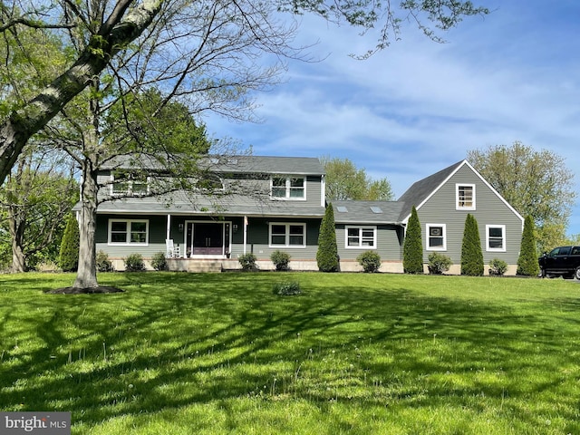 view of front of house with a porch and a front yard