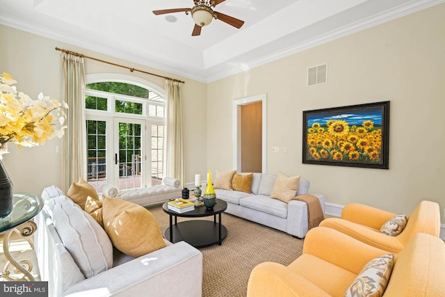 696 Miller Ave, Great Falls, VA 22066 - living room with a ceiling fan, a tray ceiling, carpet floors, crown molding, and visible vents