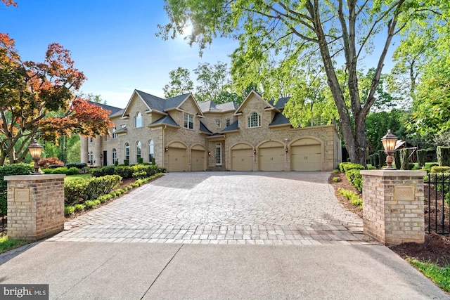 696 Miller Ave, Great Falls, VA 22066 - view of front of home with decorative driveway and a garage