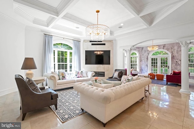 696 Miller Ave, Great Falls, VA 22066 - living area featuring crown molding, decorative columns, and a notable chandelier