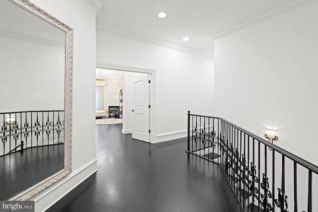 696 Miller Ave, Great Falls, VA 22066 - hallway with ornamental molding, an upstairs landing, recessed lighting, dark wood-style floors, and baseboards