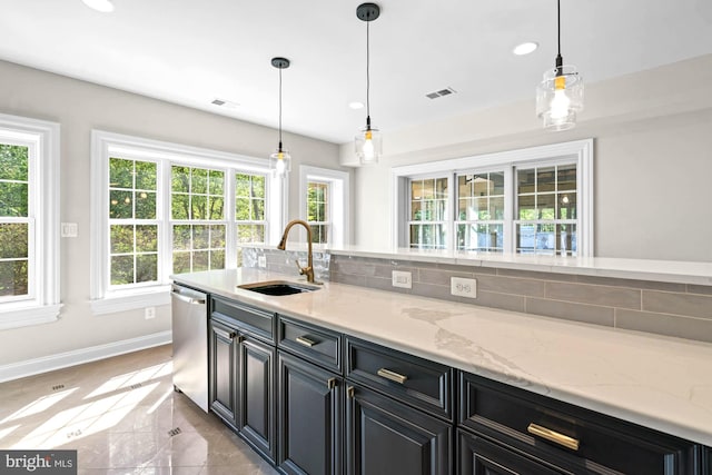 696 Miller Ave, Great Falls, VA 22066 - kitchen with dishwasher, dark cabinetry, baseboards, visible vents, and a sink