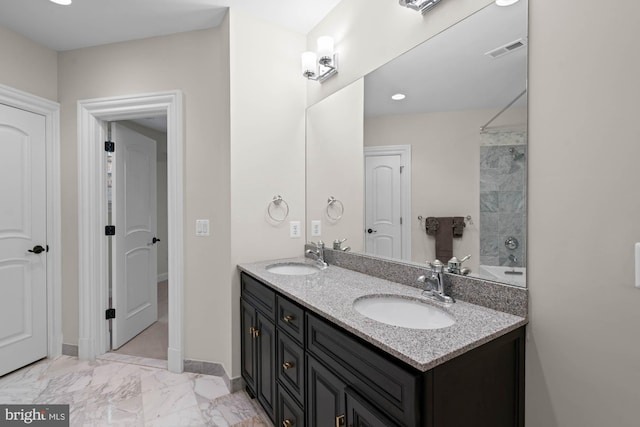696 Miller Ave, Great Falls, VA 22066 - bathroom with baseboards, marble finish floor, double vanity, and a sink