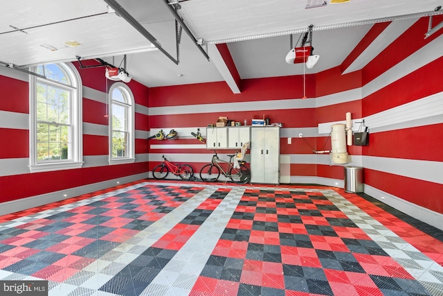 696 Miller Ave, Great Falls, VA 22066 - garage featuring baseboards and a garage door opener