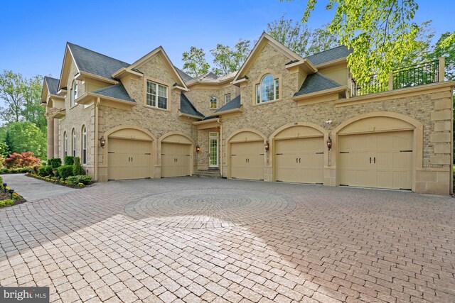 696 Miller Ave, Great Falls, VA 22066 - view of front facade with curved driveway, roof with shingles, and an attached garage