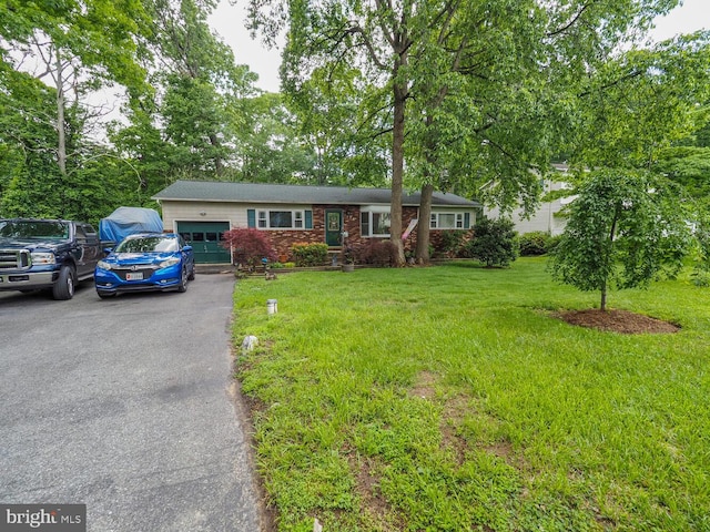 1235 Lorene Dr, Pasadena, MD 21122 - ranch-style home with an attached garage, asphalt driveway, and a front yard