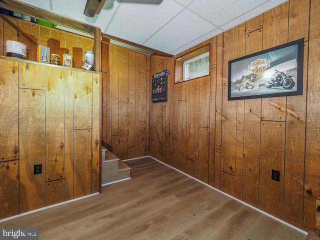 1235 Lorene Dr, Pasadena, MD 21122 - below grade area with wood walls, wood finished floors, and stairs