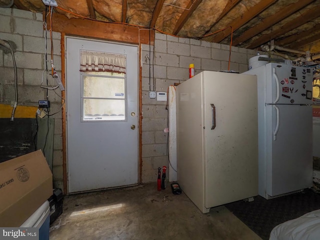 1235 Lorene Dr, Pasadena, MD 21122 - garage with freestanding refrigerator and concrete block wall