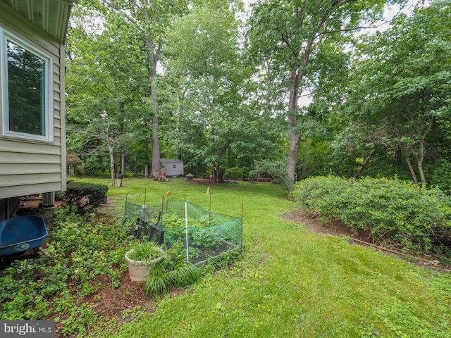 1235 Lorene Dr, Pasadena, MD 21122 - view of grassy yard with a vegetable garden