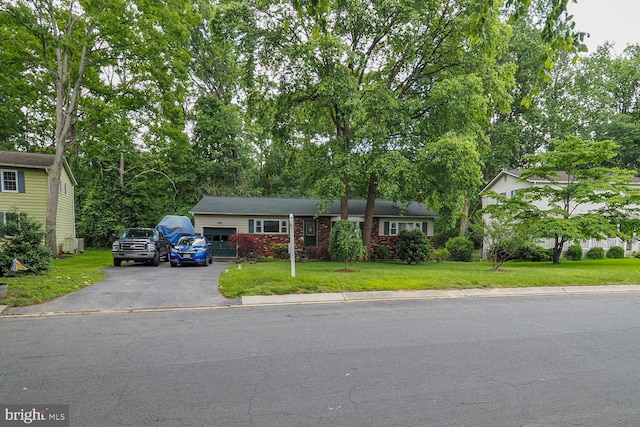 1235 Lorene Dr, Pasadena, MD 21122 - view of front of property with driveway, a front lawn, and an attached garage