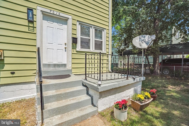 doorway to property with fence