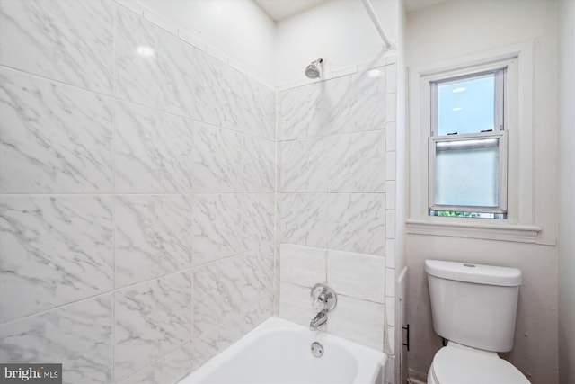 full bathroom featuring toilet and washtub / shower combination