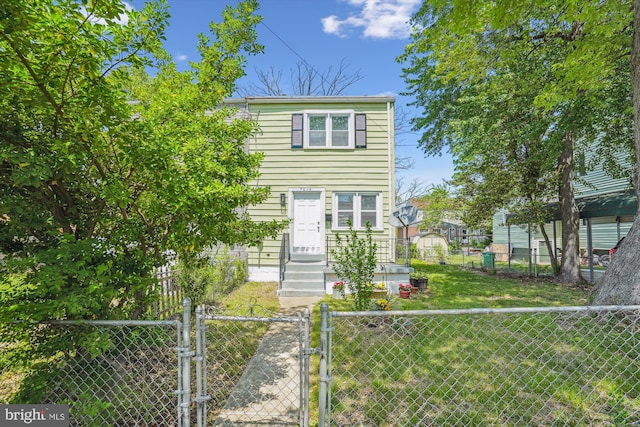 view of front of property with fence private yard and a gate