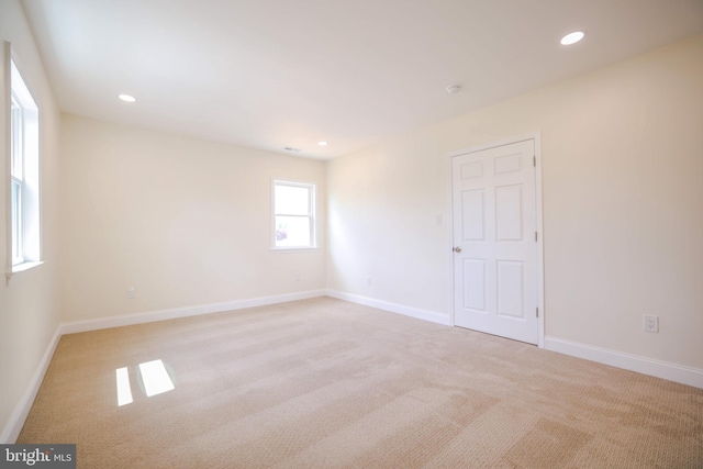 unfurnished room with recessed lighting, carpet, and baseboards