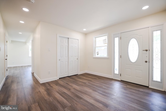 entryway with recessed lighting, baseboards, plenty of natural light, and dark wood-type flooring