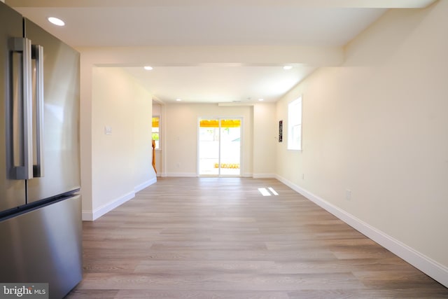 spare room with light wood-style floors, baseboards, and recessed lighting
