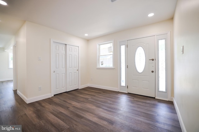 entrance foyer featuring baseboards, recessed lighting, and dark wood finished floors