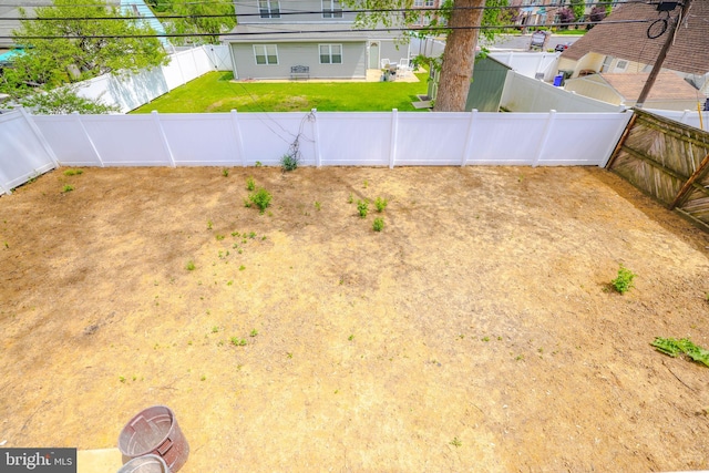 view of yard featuring a fenced backyard