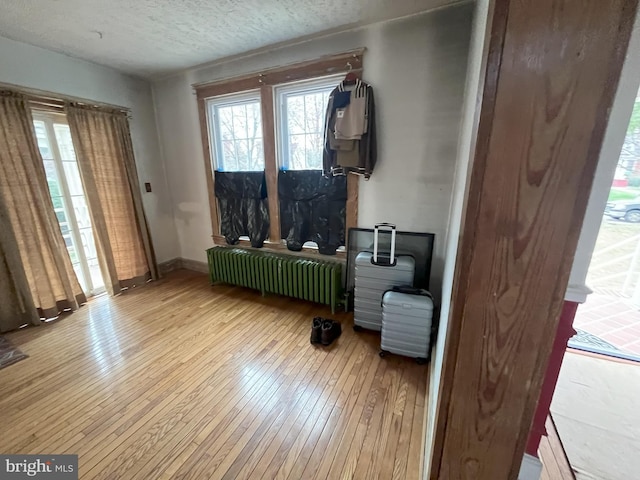 3314 Egerton Rd, Baltimore, MD 21215 - miscellaneous room featuring hardwood / wood-style flooring, baseboards, and radiator