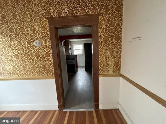 3314 Egerton Rd, Baltimore, MD 21215 - hallway with baseboards, wallpapered walls, and wood finished floors