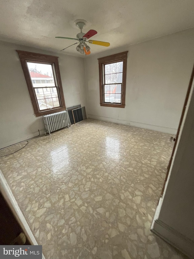 3314 Egerton Rd, Baltimore, MD 21215 - empty room with baseboards, a ceiling fan, and radiator