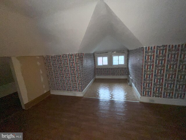 3314 Egerton Rd, Baltimore, MD 21215 - additional living space featuring baseboards, wallpapered walls, lofted ceiling, and wood finished floors