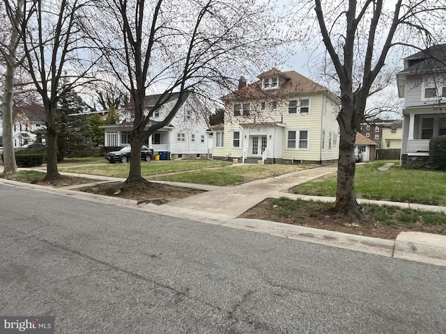 3314 Egerton Rd, Baltimore, MD 21215 - traditional style home featuring a residential view, a front lawn, and french doors