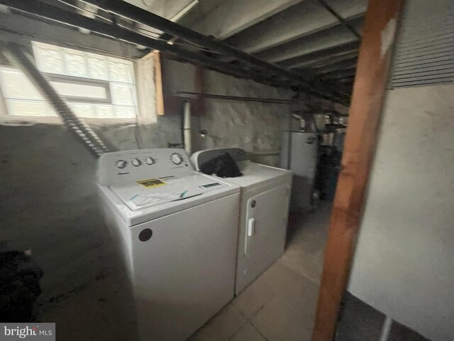 3314 Egerton Rd, Baltimore, MD 21215 - laundry room with laundry area, separate washer and dryer, and secured water heater