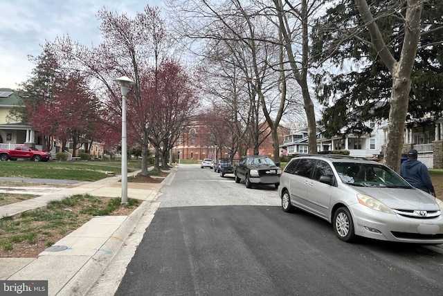 3314 Egerton Rd, Baltimore, MD 21215 - view of street with a residential view, sidewalks, street lighting, and curbs