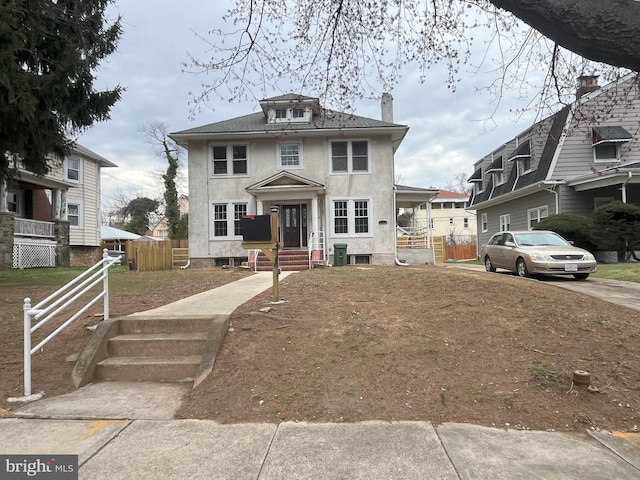 3314 Egerton Rd, Baltimore, MD 21215 - american foursquare style home with fence, a chimney, and stucco siding