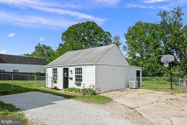 garage featuring fence and central air condition unit