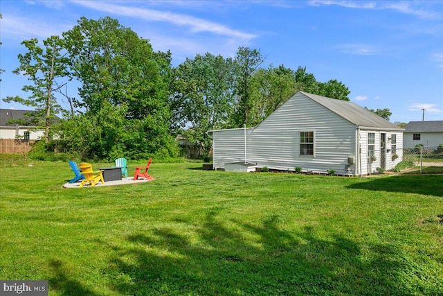 exterior space featuring fence and an outdoor fire pit