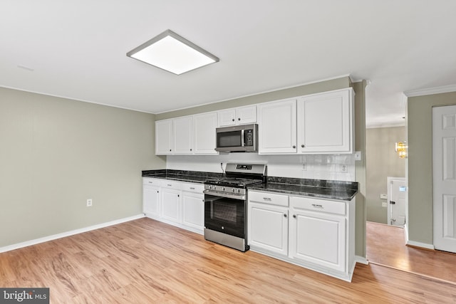 1263 Wilshire Dr, Herndon, VA 20170 - kitchen featuring appliances with stainless steel finishes, white cabinets, light wood-style flooring, crown molding, and baseboards