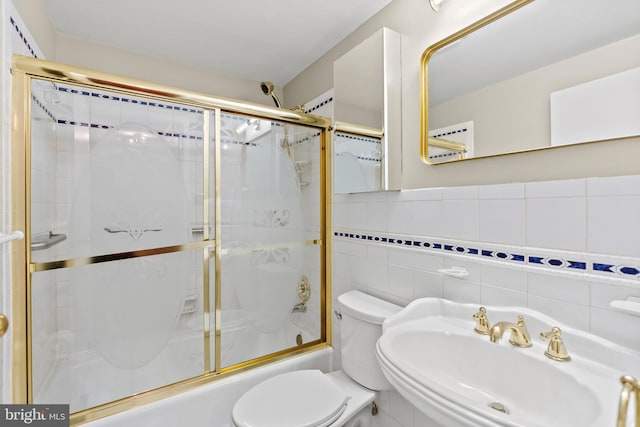 1263 Wilshire Dr, Herndon, VA 20170 - full bathroom with toilet, a sink, enclosed tub / shower combo, and tile walls