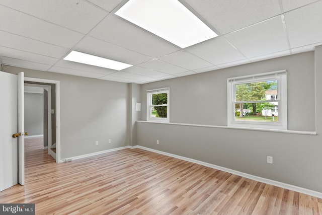 1263 Wilshire Dr, Herndon, VA 20170 - unfurnished room with light wood-type flooring, a paneled ceiling, and baseboards