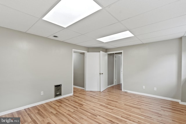 1263 Wilshire Dr, Herndon, VA 20170 - spare room featuring light wood-type flooring, a drop ceiling, and baseboards