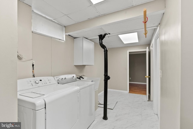 1263 Wilshire Dr, Herndon, VA 20170 - clothes washing area with separate washer and dryer, cabinet space, light marble finish flooring, and baseboards