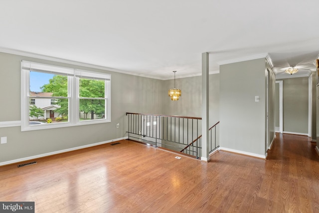 1263 Wilshire Dr, Herndon, VA 20170 - empty room with a chandelier, ornamental molding, wood finished floors, and baseboards