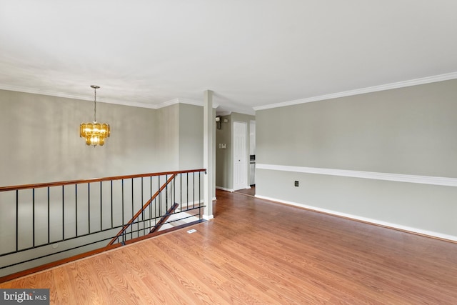 1263 Wilshire Dr, Herndon, VA 20170 - spare room with wood finished floors, a chandelier, crown molding, and baseboards