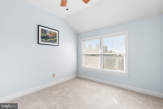 unfurnished room featuring baseboards, vaulted ceiling, ceiling fan, and light colored carpet