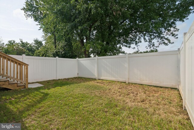 view of yard with a fenced backyard
