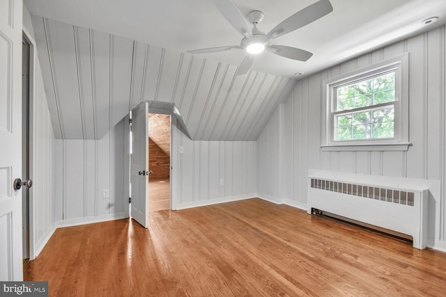 6911 Wells Pkwy, University Park, MD 20782 - bonus room featuring radiator, wood finished floors, vaulted ceiling, ceiling fan, and baseboards