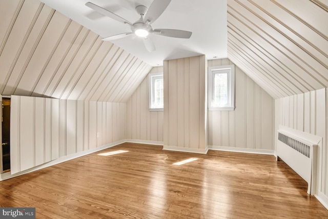 6911 Wells Pkwy, University Park, MD 20782 - bonus room featuring radiator heating unit, wood finished floors, vaulted ceiling, and ceiling fan