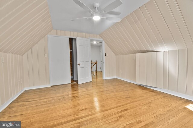 6911 Wells Pkwy, University Park, MD 20782 - additional living space featuring wood finished floors, lofted ceiling, ceiling fan, and a decorative wall