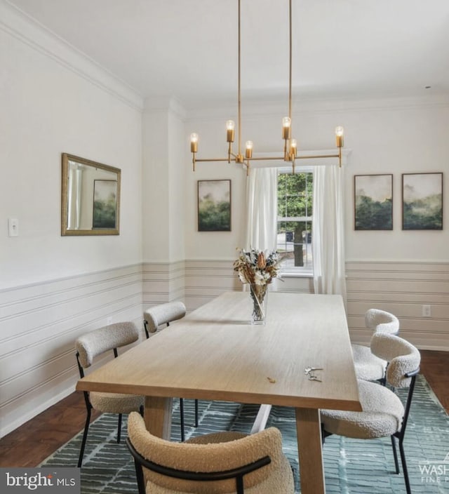6911 Wells Pkwy, University Park, MD 20782 - dining space with a chandelier, crown molding, dark wood-style flooring, and wainscoting