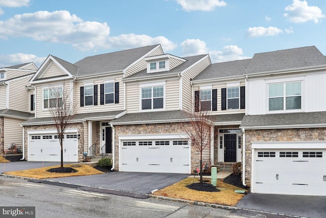 6 Skydance Way, West Chester, PA 19382 - view of property with stone siding, aphalt driveway, and an attached garage
