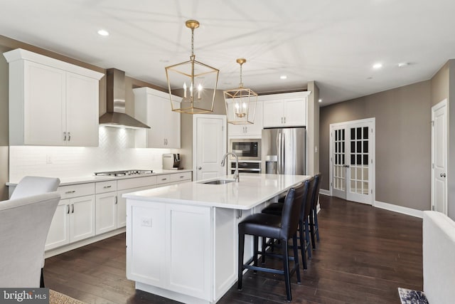 6 Skydance Way, West Chester, PA 19382 - kitchen featuring recessed lighting, wall chimney range hood, appliances with stainless steel finishes, and a sink