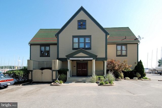 view of front of house featuring a gate and covered porch