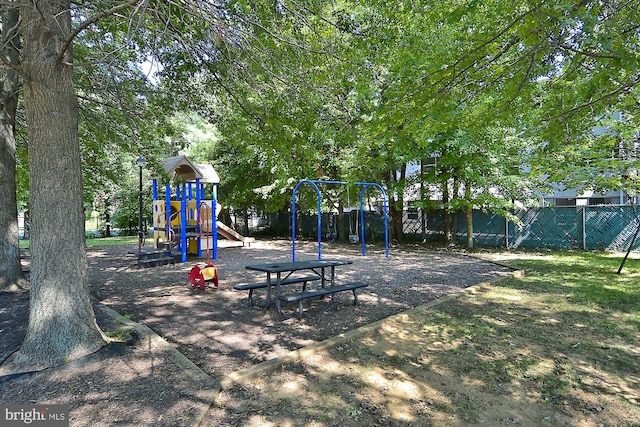 communal playground featuring fence